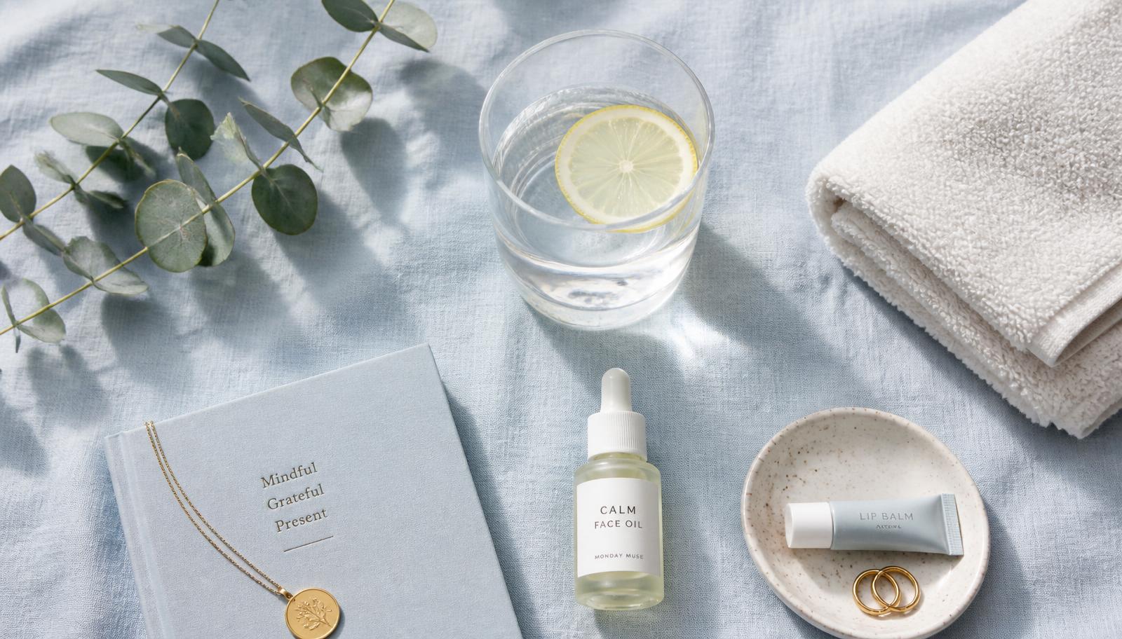 Wellness essentials arranged on pale blue linen